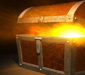 Old wooden treasure chest with strong glow from inside